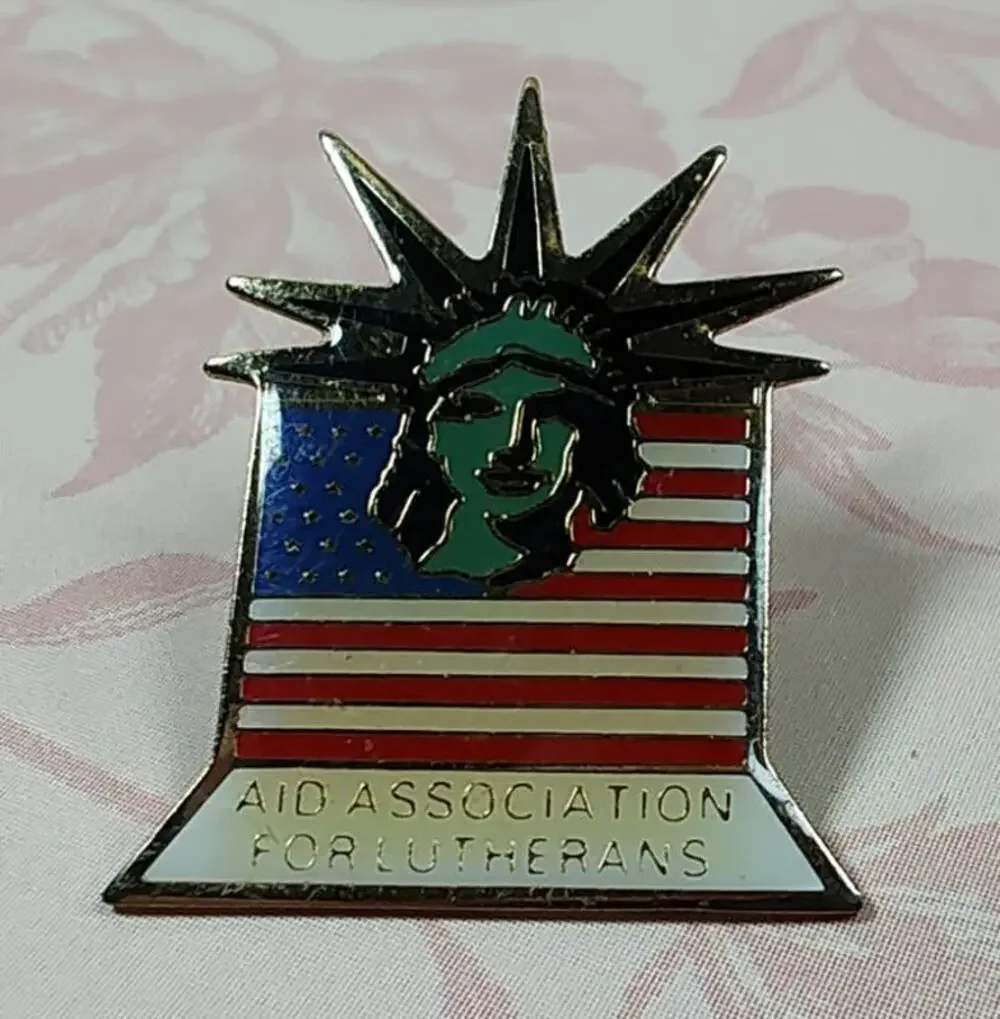 Aid Association for Lutherans 1983 Signed Statue of Liberty American Flag Pin
